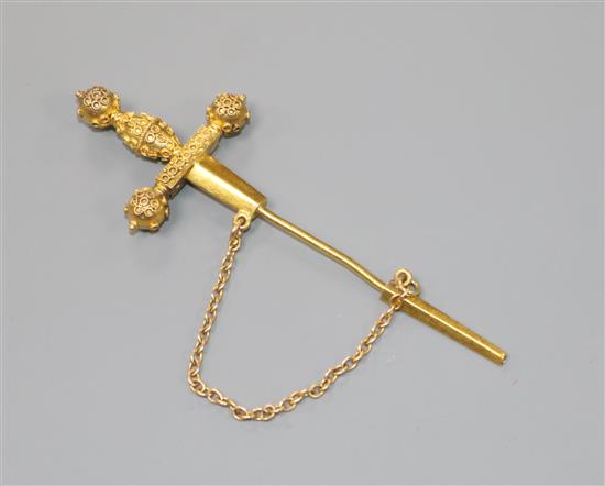 An early 20th century yellow metal dagger jabot pin, 64mm.